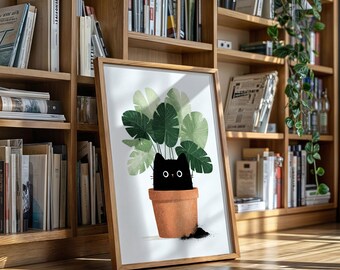 Puede incluir: Una impresión artística enmarcada que presenta una ilustración caprichosa de un gato negro asomándose de una maceta de terracota llena de grandes hojas verdes. La obra de arte está sobre un fondo blanco y enmarcada en un marco de madera clara.