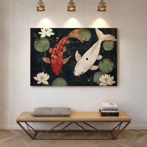 May include: A rectangular canvas print featuring two koi fish in a pond with lily pads and lotus flowers. One fish is red, the other is white. The background is dark green.