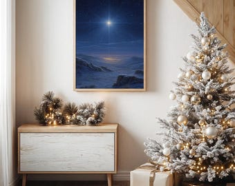 May include: A framed print of a celestial scene with a bright star illuminating a snowy landscape. The artwork is displayed above a wooden cabinet with a white front. A decorated Christmas tree and wrapped gifts are in the foreground, creating a festive holiday setting.
