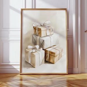 May include: Watercolor painting of stacked gift boxes in shades of beige, gray, and brown, each tied with a delicate white ribbon. The artwork is framed in a light brown wooden frame, creating a warm and inviting aesthetic.