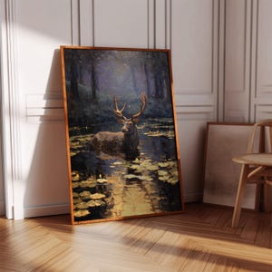 May include: A framed art print depicts a majestic deer standing in a pond surrounded by lily pads. The artwork features a dark, moody color palette with a forest backdrop and a warm, wooden frame. The deer has large antlers.