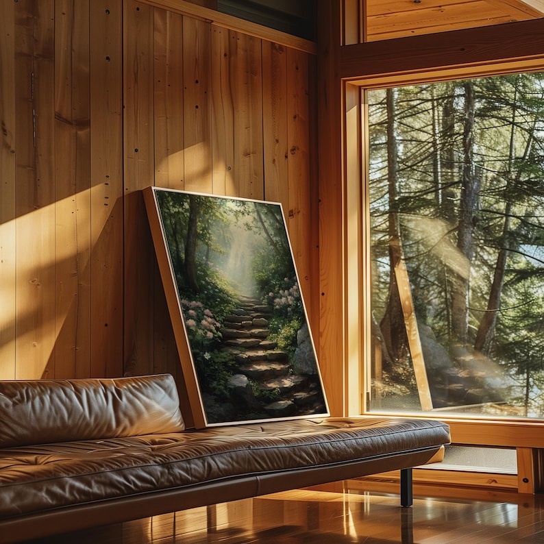 May include: A framed painting of a stone path leading through a lush green forest with a soft, ethereal light shining through the trees.