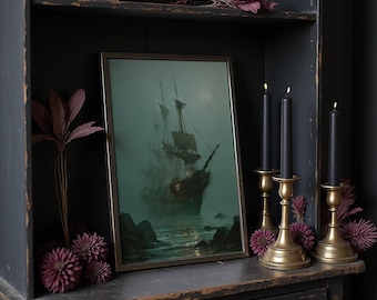 May include: A framed print of a tall ship sailing on a misty sea, displayed on a dark wooden cabinet. The print is flanked by three black candles in gold-colored candle holders and decorative purple flowers. A gold starburst decorates the top shelf.