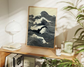 May include: A framed art print showing stylized ocean waves in grey and white. The artwork uses detailed line work, creating a sense of movement and texture. The print is displayed on a wooden shelf with books and a lamp.