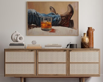 Cowboystövlar och rustik westernkonst med whisky