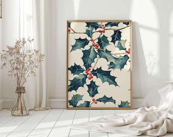 May include: A framed watercolor print featuring holly leaves and red berries. The leaves are a deep teal color, and the berries are a bright red. The print is set against a cream-colored background and framed in a light wood frame. The artwork is displayed in a bright, airy room.
