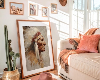 May include: A framed portrait of a Native American chief in profile, wearing a feathered headdress. A pink hat with a decorative band sits on the floor in front of the artwork. A cactus in a woven basket and a sofa with a throw and pillow are also visible.
