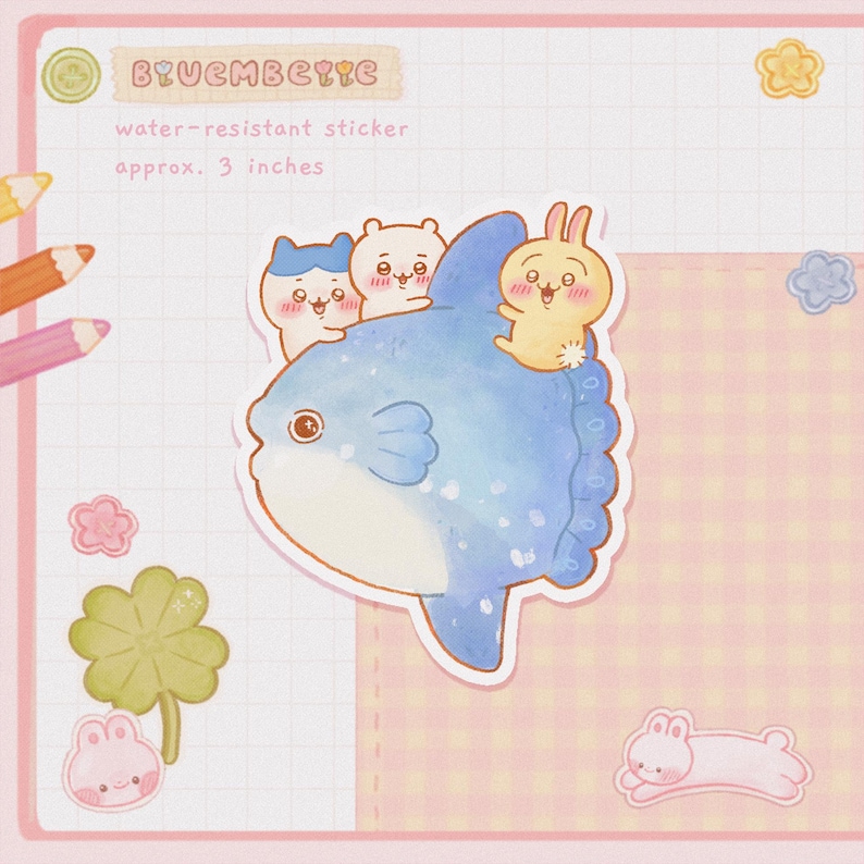 May include: A water-resistant sticker featuring a blue watercolor sunfish with three small cartoon animals on its back. The sticker is approximately 3 inches in size and has the text "BYUEMBEYYE" at the top.