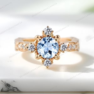 Anillo de aguamarina azul redondo, estilo vintage, chapado en oro, con diseño floral, estilo art déco, con piedra de nacimiento de marzo y circonita cúbica, ideal como regalo de aniversario de oro para mujer.