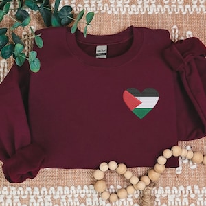 Sweater with heart logo sale