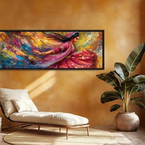a painting hanging on a wall above a chaise