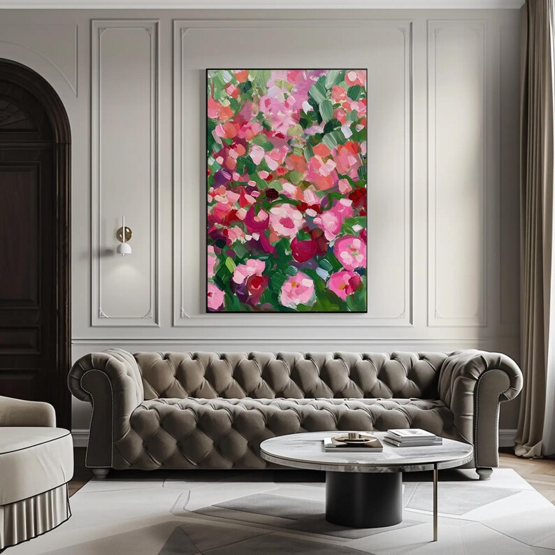 a living room with a couch and a painting on the wall
