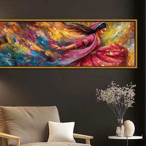 a painting hanging on a wall above a chair