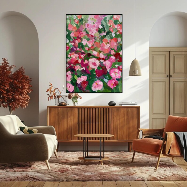 a living room filled with furniture and a painting on the wall