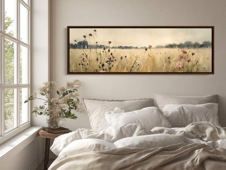 a bedroom with a bed and a painting on the wall