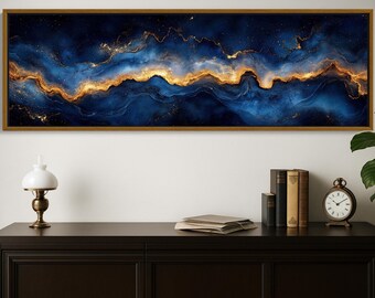 May include: A rectangular wall art piece featuring an abstract fluid design with deep navy blue and swirling gold metallic accents. The artwork is enclosed in a thin wooden frame and displays a horizontal composition of flowing colors.