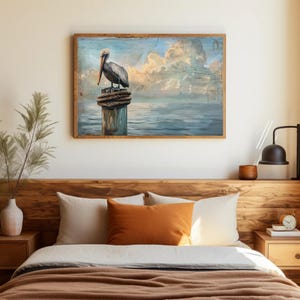 a painting of a pelican sitting on a post in a bedroom