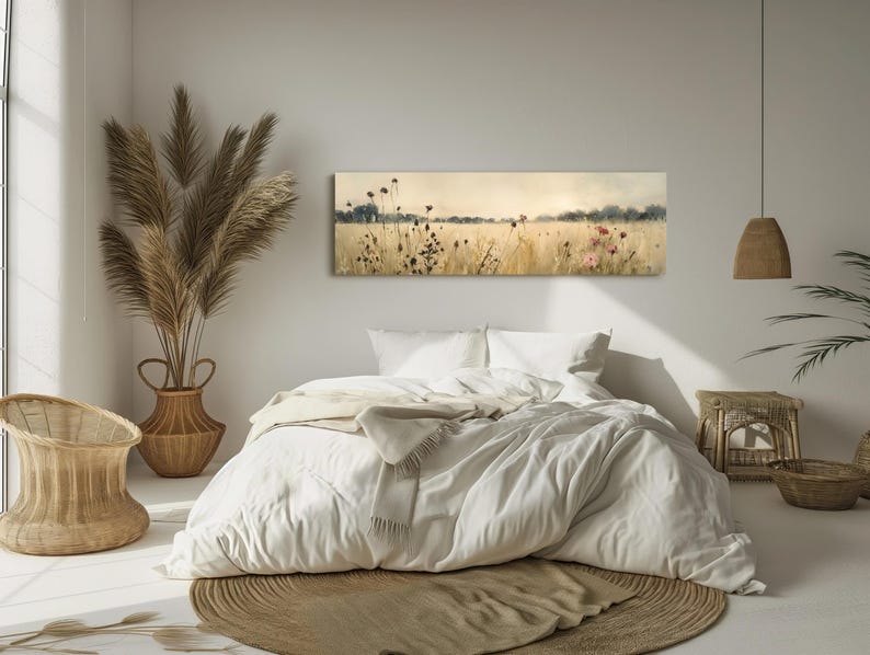 a bedroom with a large bed and a painting on the wall