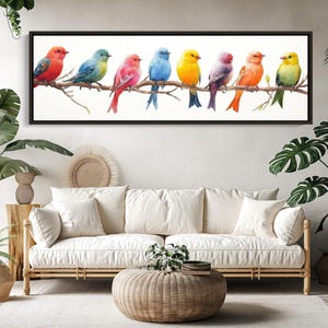 Puede incluir: Una impresión de arte mural rectangular horizontal que muestra ocho pájaros coloridos posados en fila sobre una sola rama de árbol marrón contra un fondo blanco liso. Los pájaros exhiben un plumaje vibrante en tonos rojo, azul, rosa, amarillo y naranja.