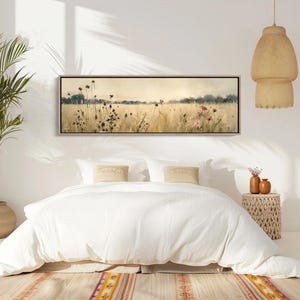 a bedroom with a bed and a plant in the corner