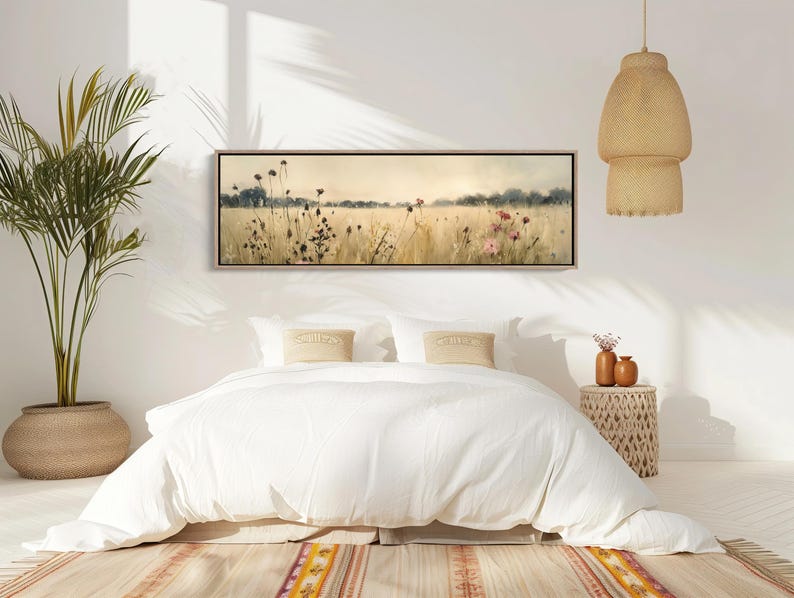 a bedroom with a bed and a plant in the corner