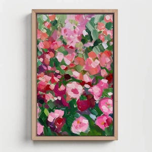 a painting of pink flowers on a white wall