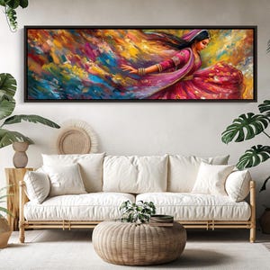 a living room with a couch and a painting on the wall