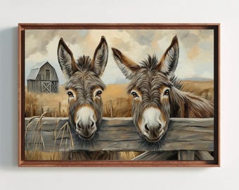 May include: A framed wall art print featuring two brown donkeys peering over a weathered wooden fence. In the background, a rustic barn stands in a dry, golden field under a cloudy sky. The artwork uses textured brushstrokes to depict the animals.