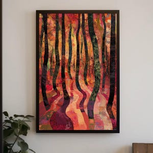 May include: Abstract art print of a forest scene with tall, dark tree trunks and a winding path. The artwork features a vibrant color palette of red, orange, and green hues, framed in a black border. The print is mounted on a white wall.