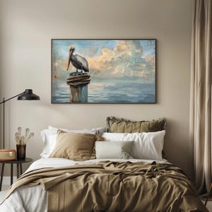 a painting of a pelican sitting on a post in a bedroom