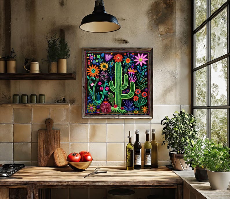 a picture of a cactus on a wall above a kitchen counter