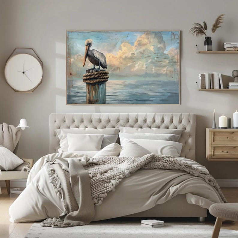 a bedroom with a large painting of a pelican on the wall
