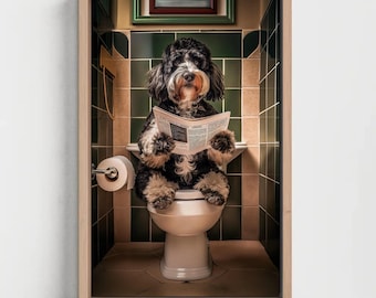 May include: A framed wall art print featuring a black and white dog with long fur sitting on a white toilet in a bathroom with dark green tiled walls. The dog is holding an open newspaper with visible text, and a roll of toilet paper is on a holder.