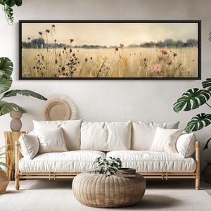 a living room with a couch and potted plants