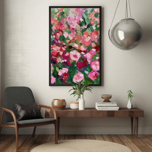a painting of pink flowers on a white wall