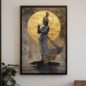 May include: A framed wall art print featuring a dark blue figure standing on a dark rock, playing a golden flute. The figure wears draped clothing and a headpiece with a feather. A large, textured golden circular sun sits behind the figure.