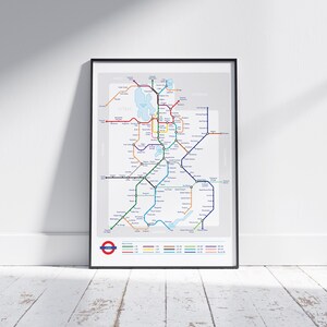 May include: A black framed poster with a map of the London Underground. The map shows the different lines and stations of the subway system. The poster includes a legend with the colors of each line.