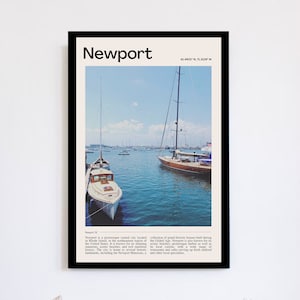 May include: A framed print featuring a harbor scene in Newport, Rhode Island, with sailboats and the text "Newport." The image includes a blue sky and water, with a white boat in the foreground.