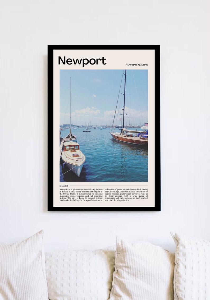 May include: A framed print featuring a harbor scene in Newport, Rhode Island, with sailboats and the text "Newport." The image includes a blue sky and water, with a white boat in the foreground.