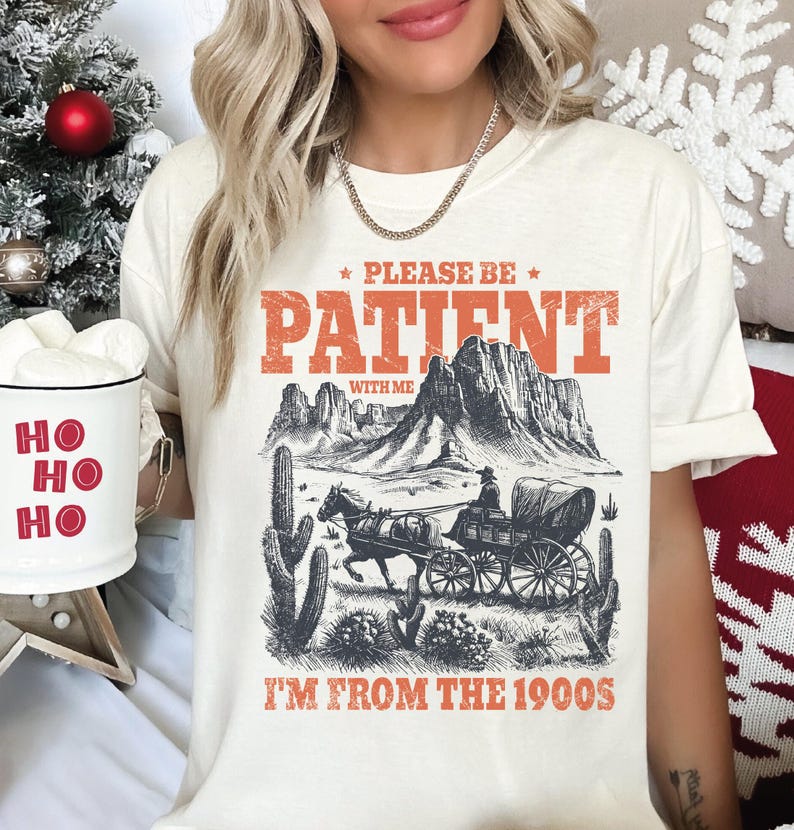 a woman wearing a t - shirt that says please be patient i'm from