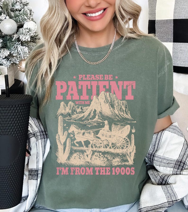 a woman with blonde hair wearing a green shirt