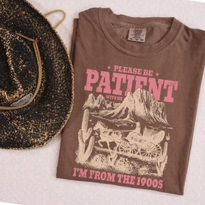 a brown shirt with a cowboy hat next to it