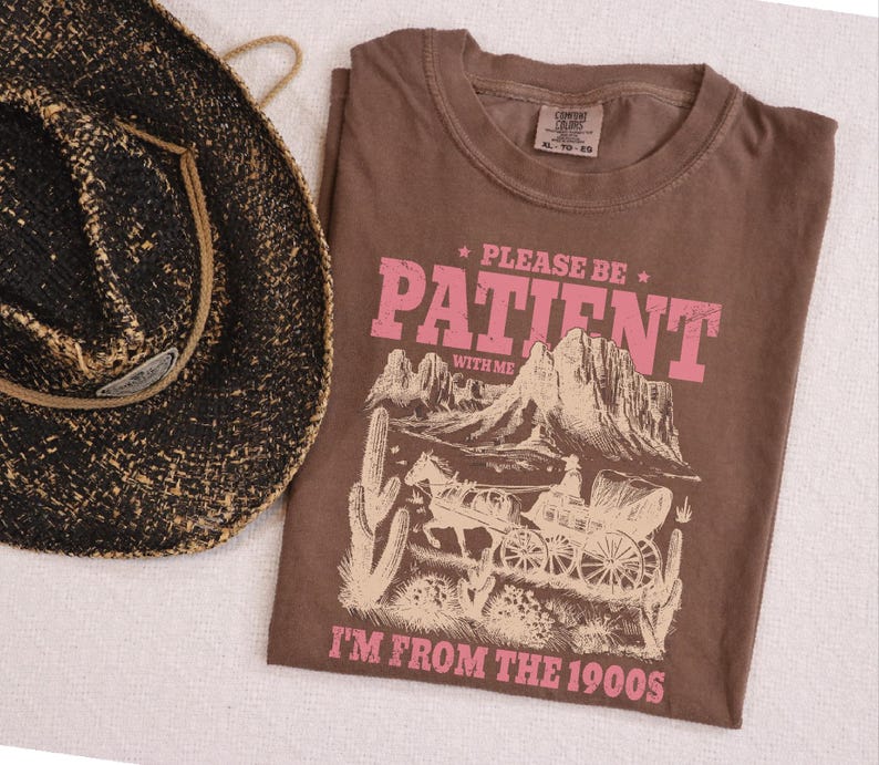a brown shirt with a cowboy hat next to it