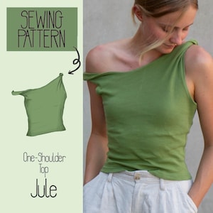 May include: A sewing pattern for a one-shoulder top called "Jule". The pattern includes a line drawing of the top and a photo of a person wearing the finished garment. The top is a light green color.