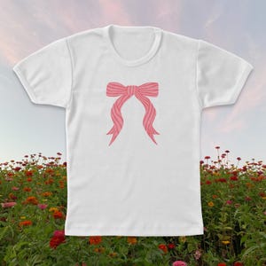 Bow Baby Tee | Women&#39;s Graphic T-Shirt | Classic Baby Tee Fit | Coquette Bow