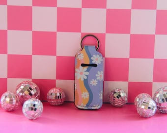 Groovy Daisy Chapstick Schlüsselbund: Trendiger Lippenbalsam Halter
