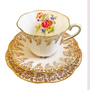 Clare Teacup Trio with Floral 22K Gold Filigree on White Bone China. Gold Rim with Colourful Bouquet. Very Good Condition from 1950s. 6 sets