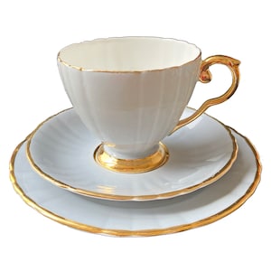 Edwardian 22 Karat Gold and Grey Fine Bone China Ribbed Teacup, Saucer and Plate
