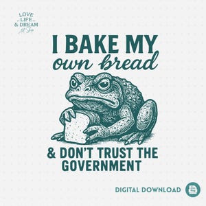 Puede incluir: Descarga digital con una ilustración detallada de un sapo gruñón sosteniendo una rebanada de pan. El texto dice "I BAKE MY own bread & DON'T TRUST THE GOVERNMENT". El diseño es en tonos turquesa y blanco, con "DIGITAL DOWNLOAD" en la parte inferior.