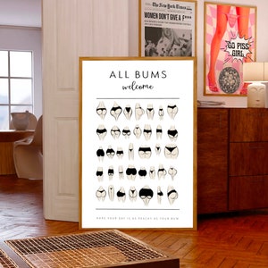 May include: A white poster with the text "ALL BUMS welcome" and a grid of 36 black and white illustrations of different body types. The text at the bottom of the poster reads "HOPE YOUR DAY IS AS PEACHY AS YOUR BUM."